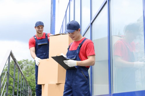 Man with van loading furniture for a removal job in Harrow