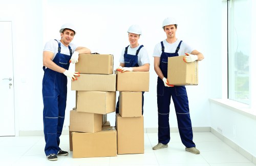 Professional movers loading furniture for a Harrow relocation