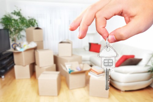 Removal specialists handling furniture during a Harrow relocation