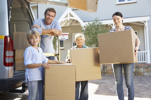 Household furniture being carried through a Harrow property