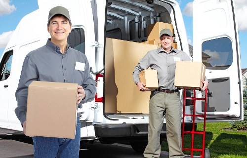 Professional movers loading a van for a local Harrow relocation