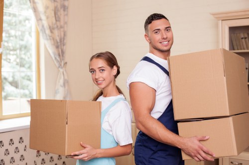 Loading furniture and boxes into a van for a Harrow collection
