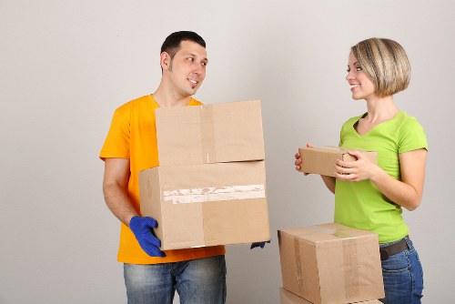 Boxes and office furniture prepared for a business move in Harrow